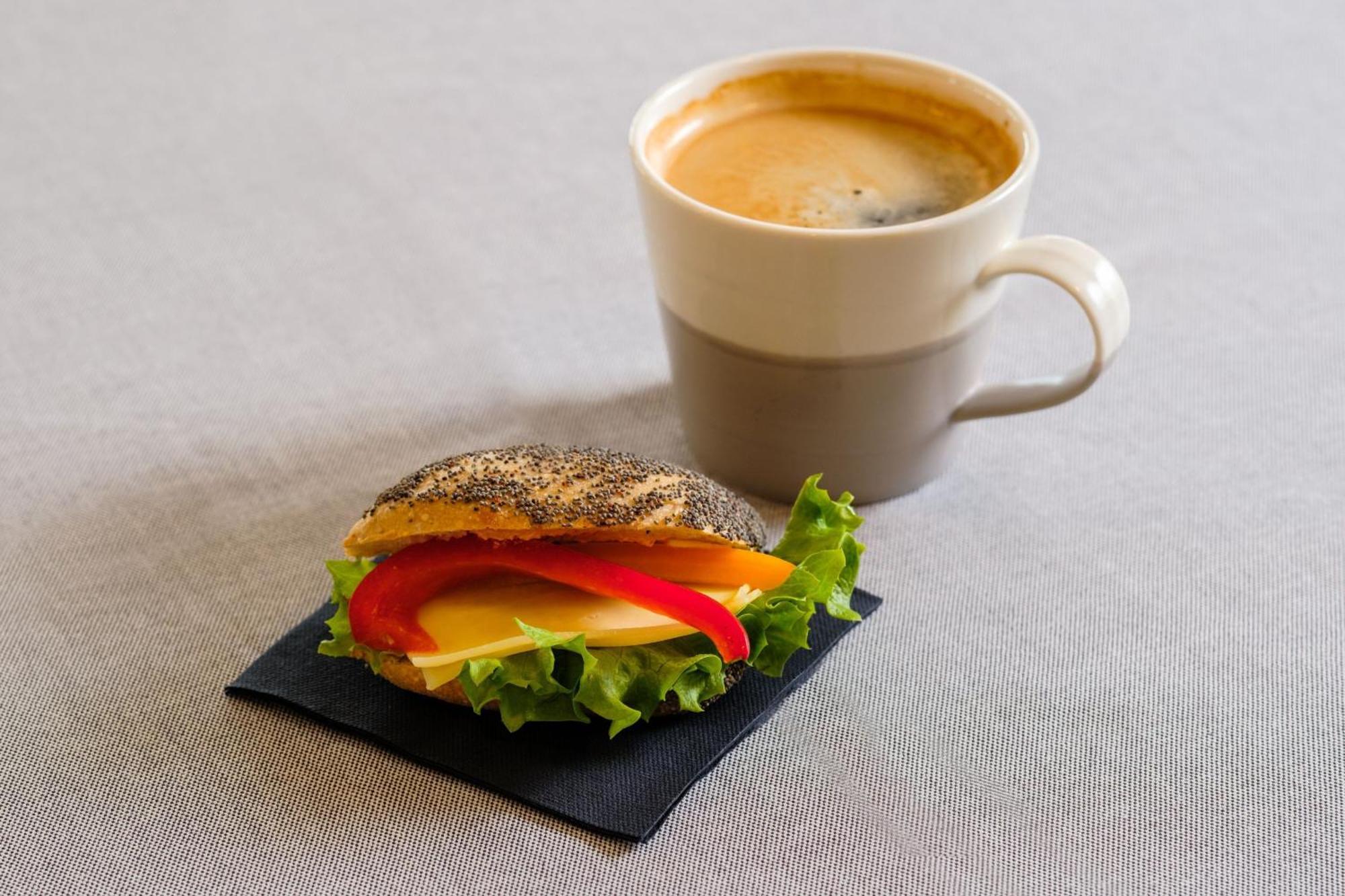Sheraton Stockholm Hotel Exterior photo A coffee and a sandwich